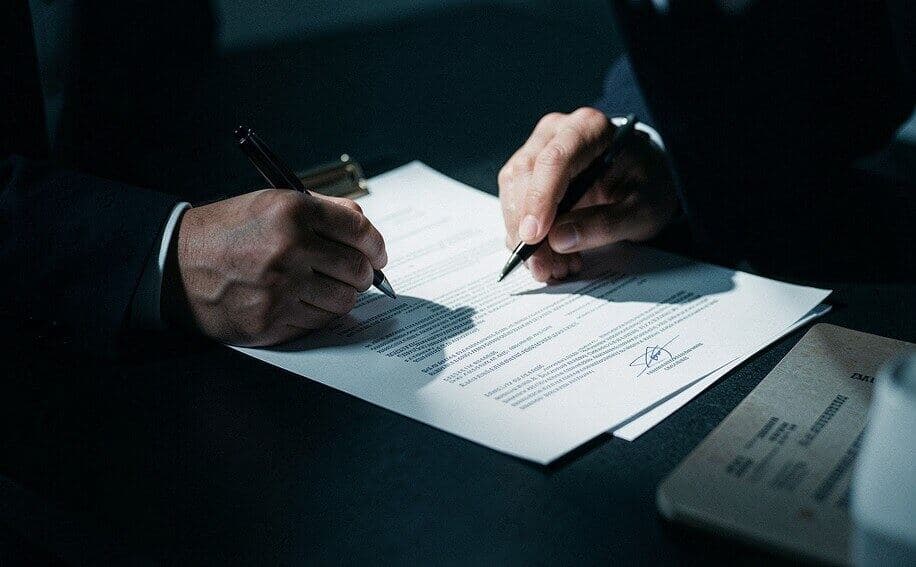 Executive reviewing documents at a desk